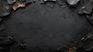 Black cracked stone background with a hole in it photo