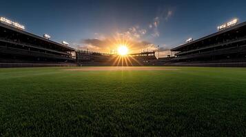 A baseball field with a sunset in the background photo