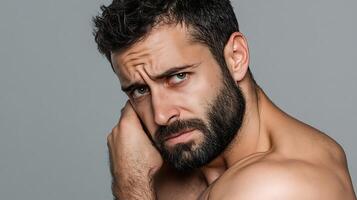A man with a beard and a beard is looking at the camera photo