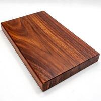 A fine mahogany wood surface with a glossy finish, featuring intricate grain patterns and a warm tone, photographed on a white background photo