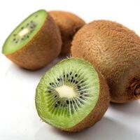 Kiwi fruit cut in half, displaying the bright green pulp and dark seeds, set against a pristine white background photo