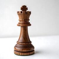 Elegant close up shot of a wooden chess king on a chessboard, emphasizing its polished finish and the surrounding chess pieces photo
