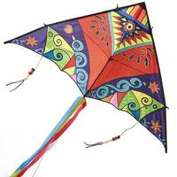 Dynamic kite with vibrant geometric patterns and colorful streamers soaring high above, a symbol of outdoor fun and exploration photo