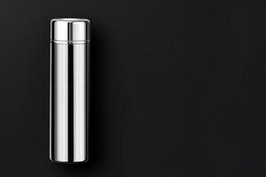 Metal water bottle on black photo