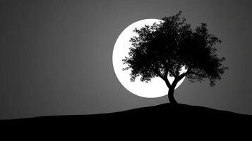 Tree silhouette against bright moon photo