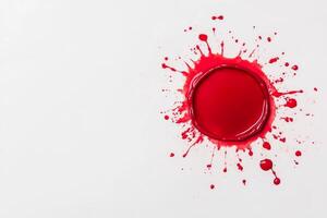 Bright red paint splash on a white canvas in a creative workspace photo