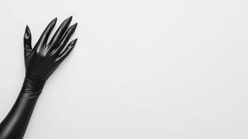 Black gloved hand against a plain white background photo