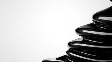 Elegant black sculpture made of fluid material on a white surface photo