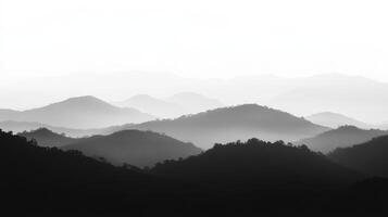 Serene black and white mountain landscape with layered hills photo