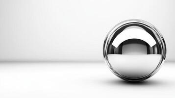 Reflective silver sphere resting on a smooth surface photo