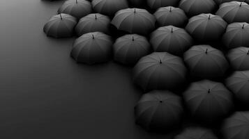 Unique array of black umbrellas on a smooth dark surface photo
