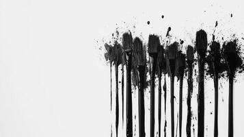 Creative abstract expression of black paint splatters on white canvas photo
