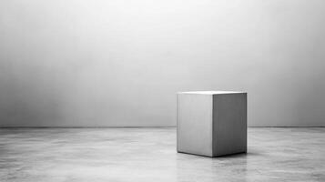 Minimalist composition with a gray cube in an empty space photo