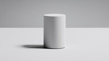 Minimalist cylindrical object on a plain surface in soft light photo
