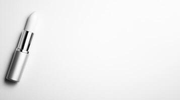 Elegant lipstick resting on a clean surface inviting creativity photo