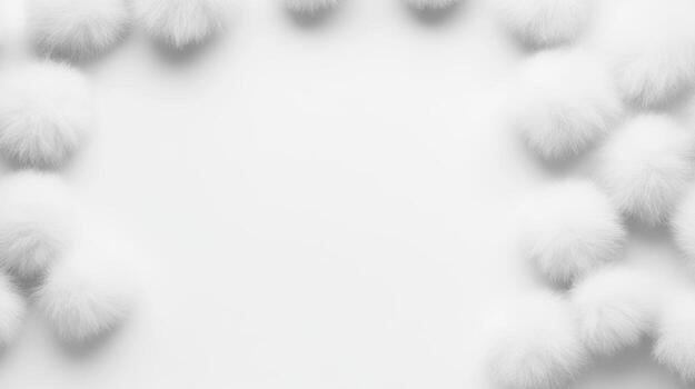 Soft white pom poms create an enchanting border on blank canvas photo