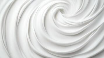 Swirling patterns of creamy white texture on a smooth surface photo