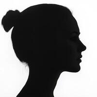 Silhouette of a woman against a bright background photo