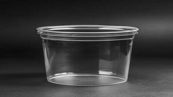 Clear plastic container on a dark background for various uses photo