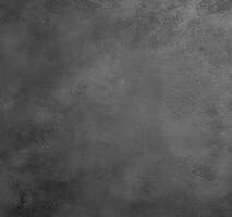 Textured dark surface with subtle variations in shade and tone photo