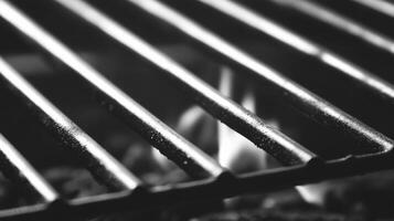 Flames dance under a grilling surface at an outdoor barbecue photo