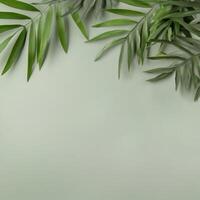 Lush green leaves arranged on a soft mint background photo