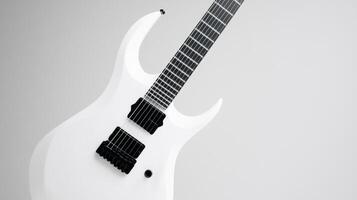 White electric guitar with sleek design on a minimal background photo