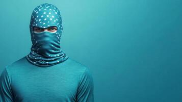 Person wearing a blue star patterned face covering indoors photo
