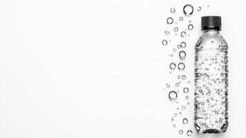 Clear water bottle with bubbles on white background photo