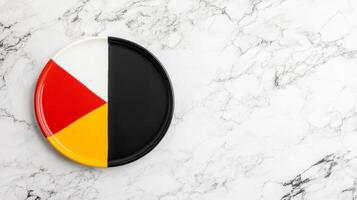 Colorful divided plate on a smooth marble surface photo
