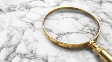 Magnifying glass resting on marble surface in bright lighting photo
