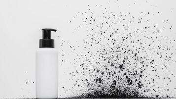 White pump bottle with black splash design photo