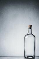 Transparent bottle with cork stopper photo