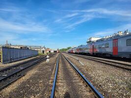 Rybinsk, Russia, 06 22 2024 Railway station, there are wagons and rails extending into the distance. photo