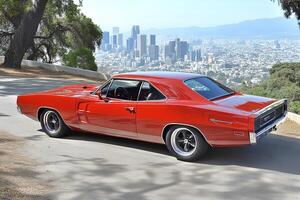 Iconic American muscle car parked in the desert landscape of Los Angeles, California, showcasing power and style against a rugged backdrop photo