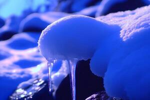 A close-up shot of sparkling icicles hanging from a rock in winter, capturing the intricate details of the frozen formations photo