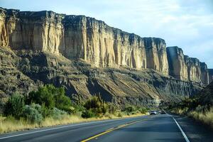 A beautiful highway winding through the stunning landscape of Capitol Reef National Park, showcasing red rock formations and desert terrain photo