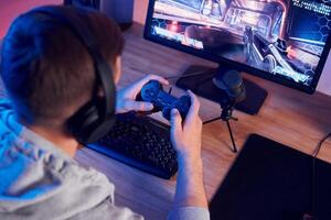A man playing games on a computer photo