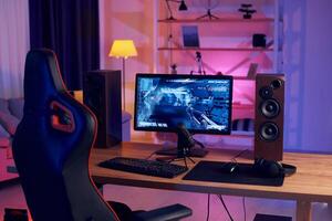 A gaming desk with a computer and speakers photo