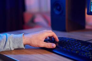 A person is typing on a computer keyboard photo