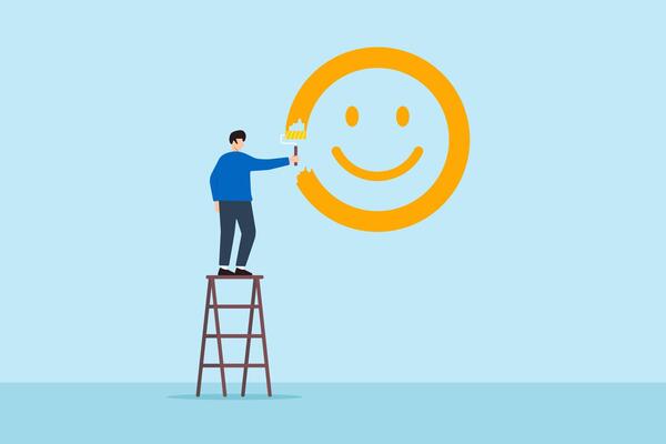 Flat illustration happy man stand on ladder to paint smiley face on wall symbolizing happiness and positive thinking
