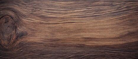 A close up of a wooden surface with a dark stain photo