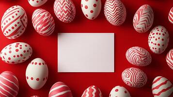 Red and white Easter eggs with abstract patterns and blank card on a red background, festive layout photo