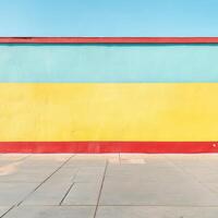 A colorful wall with a blue, yellow and red stripe photo