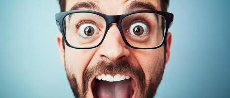 A man with glasses and a beard is making a funny face photo