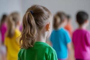 Children participate in a vibrant dance class in a bright studio setting during afternoon hours photo