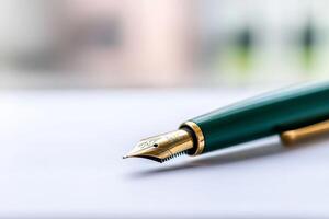 Fine fountain pen rests on a crisp white surface in a bright workspace illuminated by natural light photo