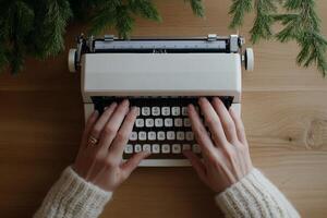 Hands typing on a vintage typewriter surrounded by greenery in a cozy setting photo