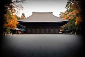 Historic temple surrounded by autumn foliage in a serene garden setting during early morning light photo
