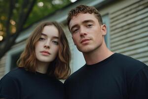 Young couple poses closely together outdoors in a casual setting under soft natural light during golden hour photo